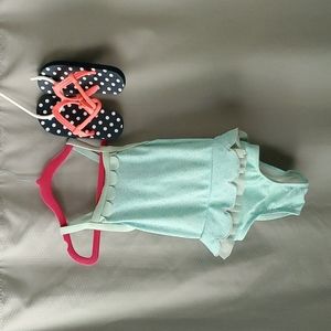 Toddler bathing suit and flip flops